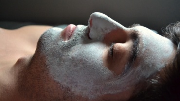Man relaxing during a facial